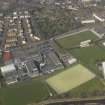 Oblique aerial view centred on Linlithgow Academy with the football ground, taken from the S.