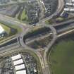 Oblique aerial view centred on the motorway interchange, taken from the E.