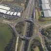 Oblique aerial view centred on the motorway interchange, taken from the NNW.