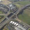 Oblique aerial view centred on the motorway interchange, taken from the ESE.