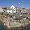 View of W wall of harbour, Crail, from SSW