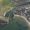 Oblique aerial view of Eyemouth centred on the harbour, taken from the NNW.