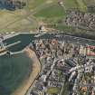 Oblique aerial view of Eyemouth centred on the harbour, taken from the WNW.