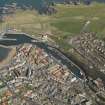 Oblique aerial view of Eyemouth centred on the harbour, taken from the WSW.