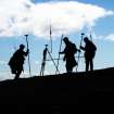 Silhouette of surveyors at the end of the day on St Kilda. James Hepher, Adam Welfare and Ian Parker of RCAHMS.
