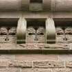 E side.  Decorative wallhead stonework. Detail