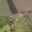 Oblique aerial view centred on the country house with the garden adjacent, taken from the NNW.
