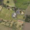 Oblique aerial view centred on the country house with the garden adjacent, taken from the SW.