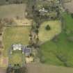 Oblique aerial view centred on the country house with the garden adjacent, taken from the SSE.