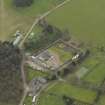 General oblique aerial view centred on the walled garden with the stable block  adjacent, taken from the NW.