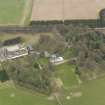 Oblique aerial view centred on the country house with the tower-house adjacent, taken from the SSW.