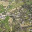 Oblique aerial view centred on the stables with the country house (hotel) adjacent,  taken from the SSW.