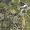 Oblique aerial view centred on the stables with the country house (hotel) adjacent,  taken from the E.