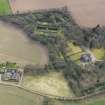 Oblique aerial view centred on the country house with the walled garden adjacent, taken from the N.