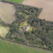 Oblique aerial view centred on the country house with the walled garden adjacent, taken from the NW.