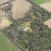 Oblique aerial view centred on the country house with the walled garden adjacent, taken from the WNW.