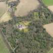 Oblique aerial view centred on the country house with the walled garden adjacent, taken from the WSW.