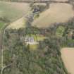 Oblique aerial view centred on the country house with the walled garden adjacent, taken from the SW.