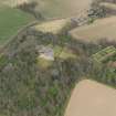 Oblique aerial view centred on the country house with the walled garden adjacent, taken from the SSW.