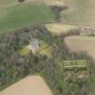 Oblique aerial view centred on the country house with the walled garden adjacent, taken from the S.