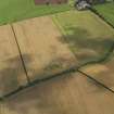 General oblique aerial view of the cropmarks of the ring ditch, taken from the WSW.