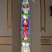 Interior. View of stained glass window on N wall