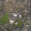 Oblique aerial view centred on the school, taken from the SW.
