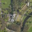 Oblique aerial view centred on the house, taken from the W.