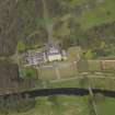 Oblique aerial view centred on the house, taken from the SW.