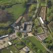 General oblique aerial view centred on the stable block, taken from the E.