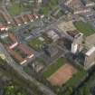Oblique aerial view centred on the Burgh Chambers wth the school adjacent, taken from the SW.
