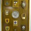 Interior, detail of board with visiting unit badges.