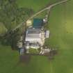 Oblique aerial view centred on the farmsteading, taken from the S.