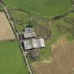 Oblique aerial view centred on the farmsteading, taken from the W.