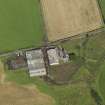 Oblique aerial view centred on the farmsteading, taken from the S.