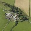 Oblique aerial view centred on the farmsteading, taken from the NE.