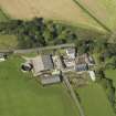 Oblique aerial view centred on the farmsteading, taken from the SE.