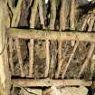 Detail of interior of hen house at The Corr, showing thatched roof structure.