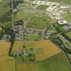 General oblique aerial view centred on the village with the abbey adjacent, taken from the S.