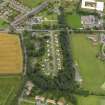 Oblique aerial view centred on the housing estate, taken from the SE.