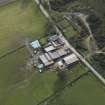 Oblique aerial view centred on the farmstead, taken from the NNE.