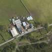 Oblique aerial view centred on the farmstead, taken from the W.