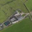 Oblique aerial view centred on the farmsteading, taken from the W.