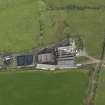 Oblique aerial view centred on the farmsteading, taken from the SW.