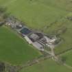 Oblique aerial view centred on the farmsteading, taken from the S.