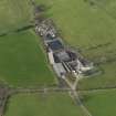 Oblique aerial view centred on the farmsteading, taken from the SSE.