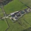 Oblique aerial view centred on the farmsteading, taken from the ENE.