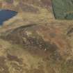 Oblique aerial view centred on Muclich Hill, taken from the SW.