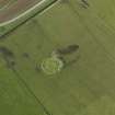 Oblique aerial view centred on the stone circle, taken from the S.