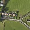 Oblique aerial view centred on the manse and church, taken from the SE.